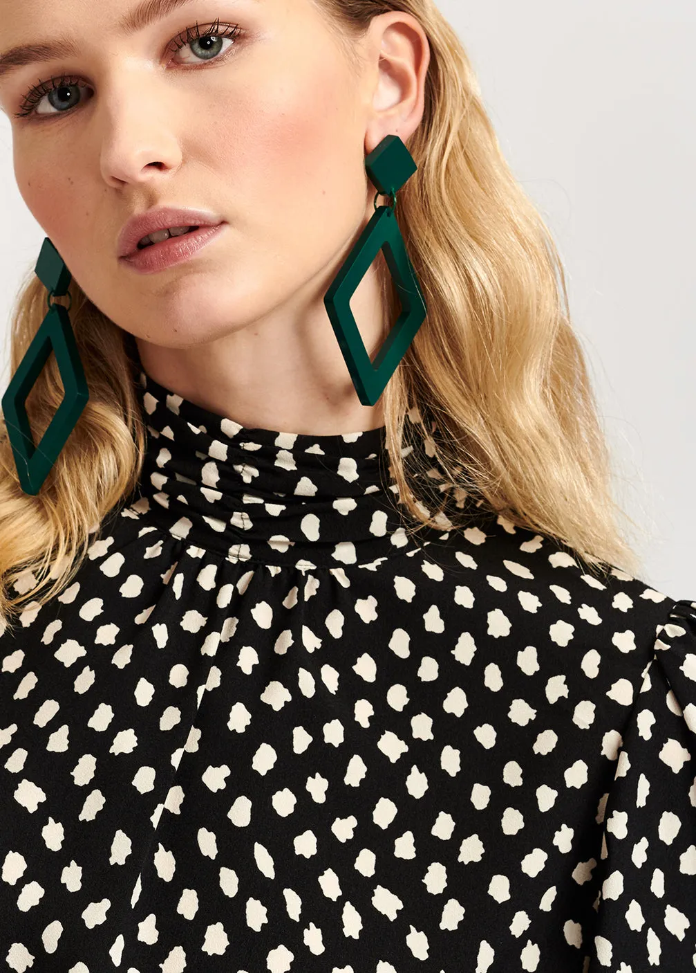 Black polka dot turtleneck top