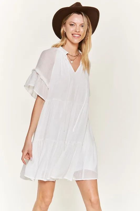 Ruffled neck tiered mini dress